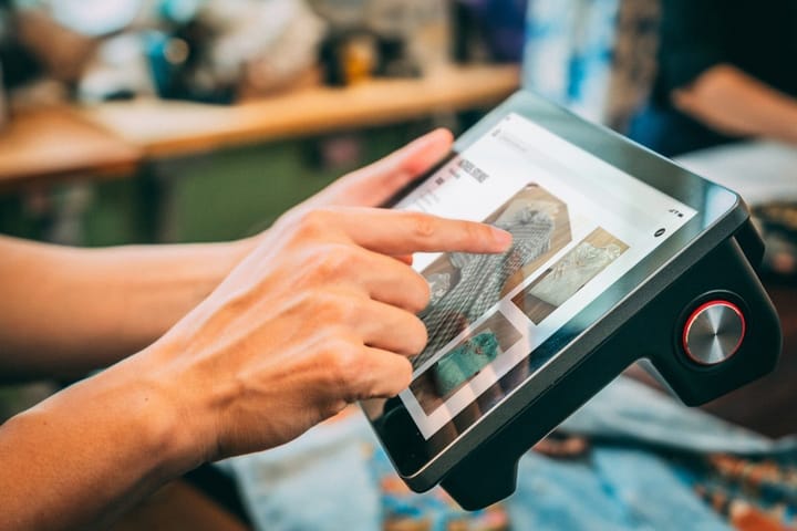 A traveler hesitates at a checkout screen, surrounded by travel planning tools and AI suggestions, highlighting trust issues.