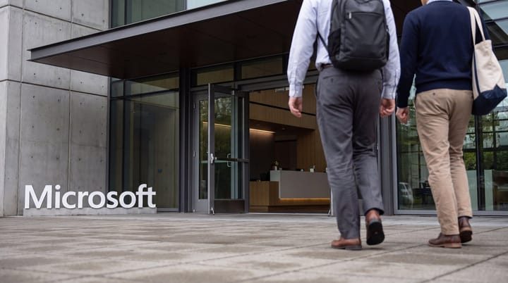 Microsoft Redmond office entrance with wordmark, empty plaza, and no temporary earnings announcement setup.